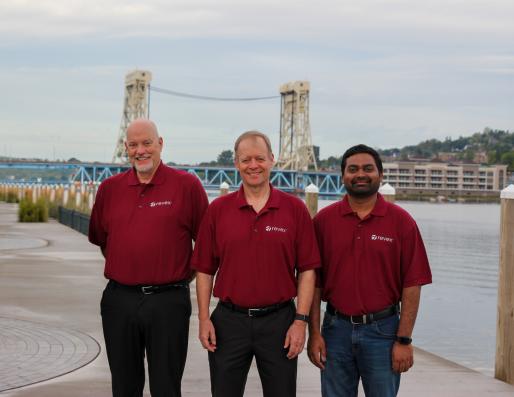 photo of revex team standing outside by the portage lift bridge 