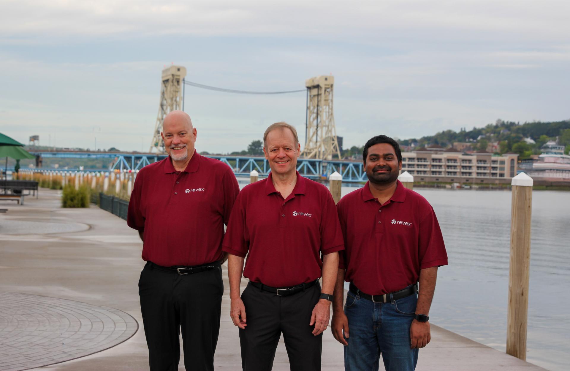 photo of revex team standing outside by the portage lift bridge 